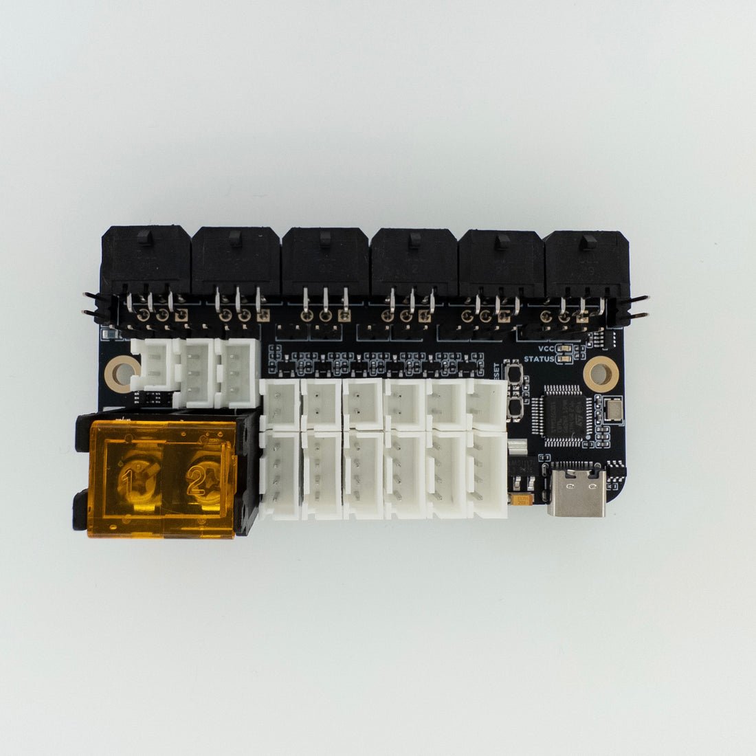 Electronic module with connectors and components on a white background