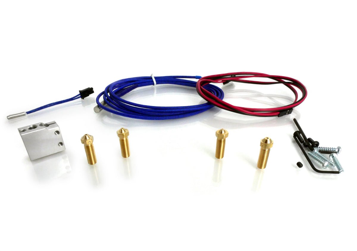 Set of electronic components including connectors, wires, and a metal block on a white background