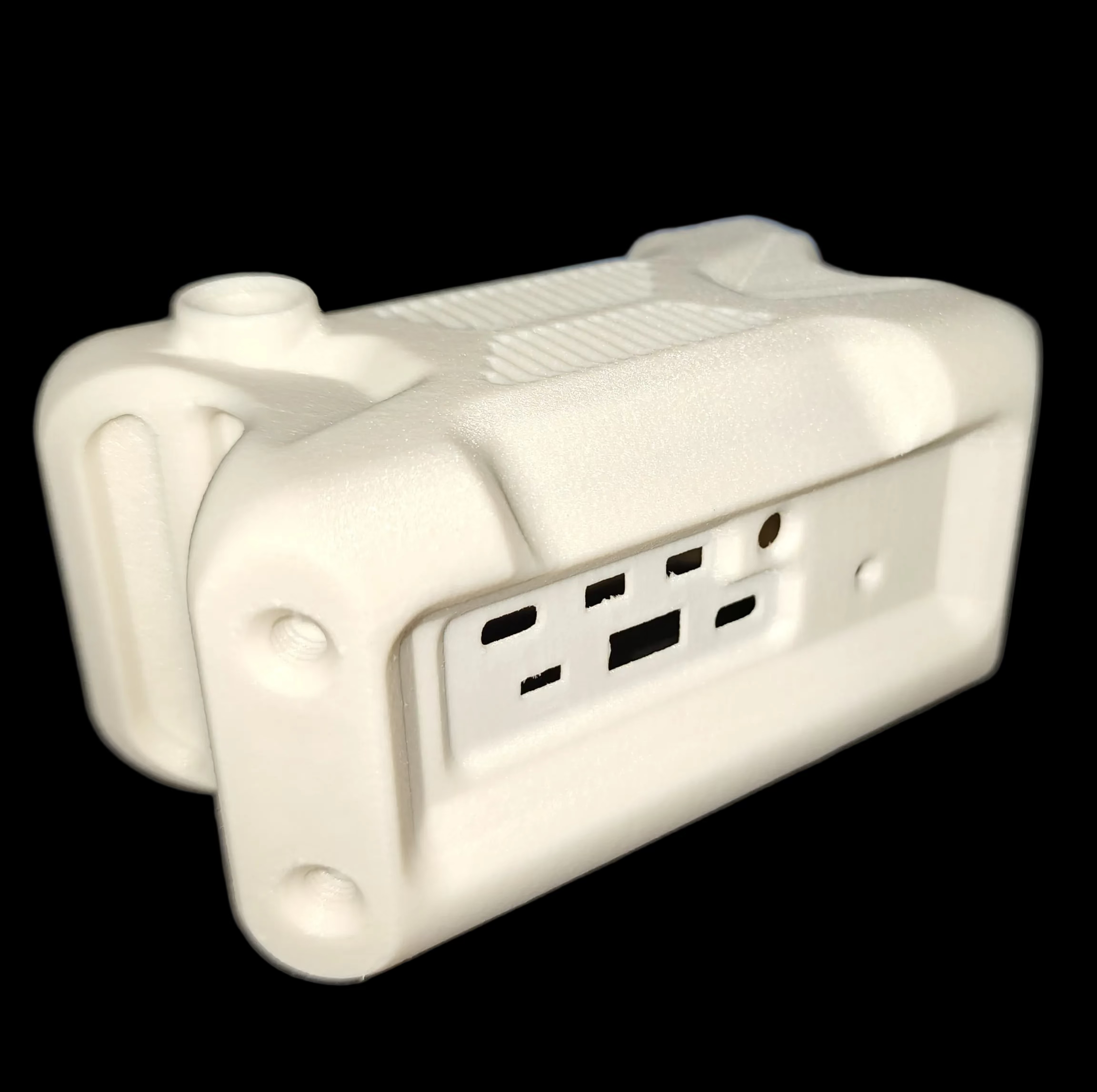 White electrical Haven housing FDM Printed in DREMC PET GF on a dark surface
