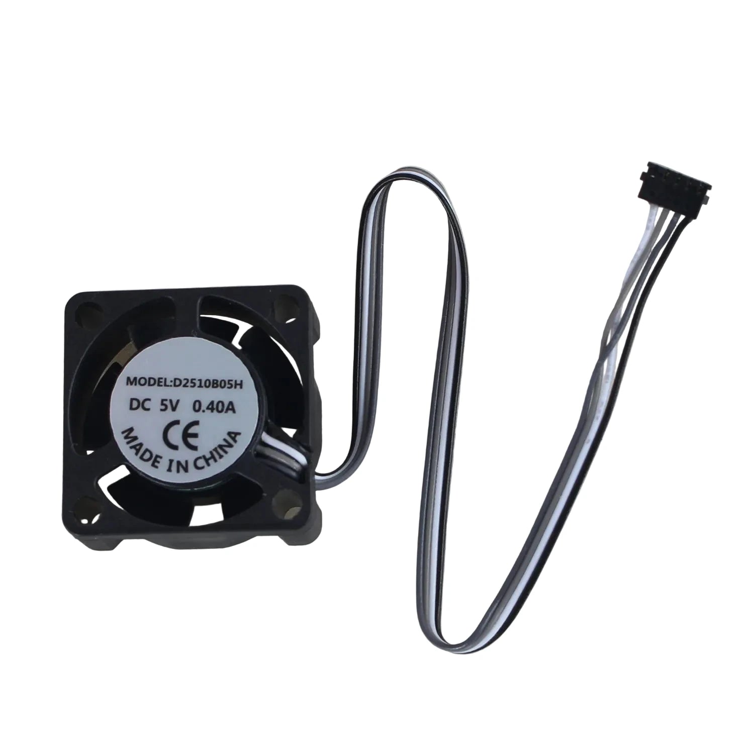 A small black cooling fan with a curved metal wire and a black connector plug, photographed on a light gray textured surface. The fan has a white circular label with printed specifications including model number, DC 5V