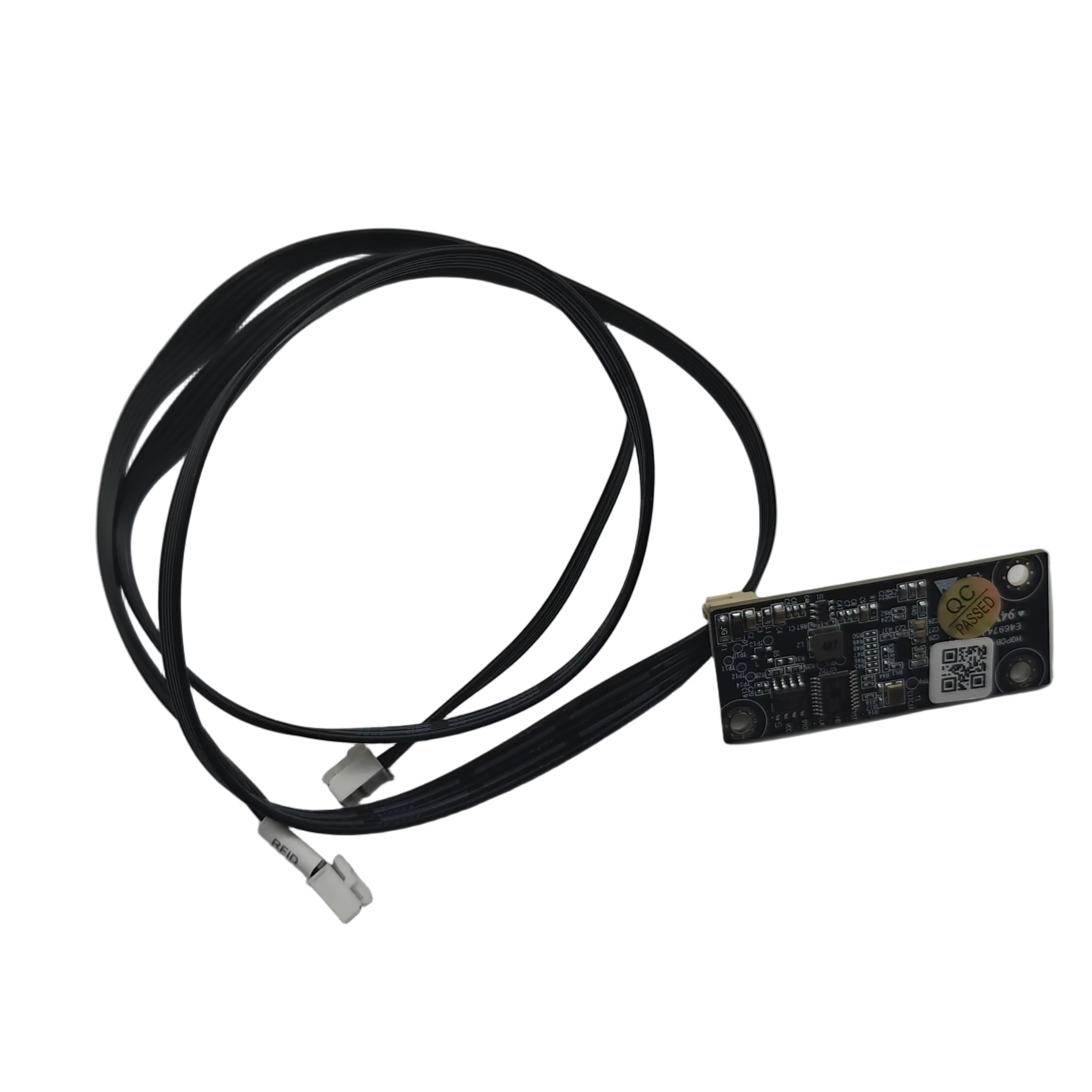 A small electronic circuit board with attached black cables and connectors, photographed on a plain light background.
