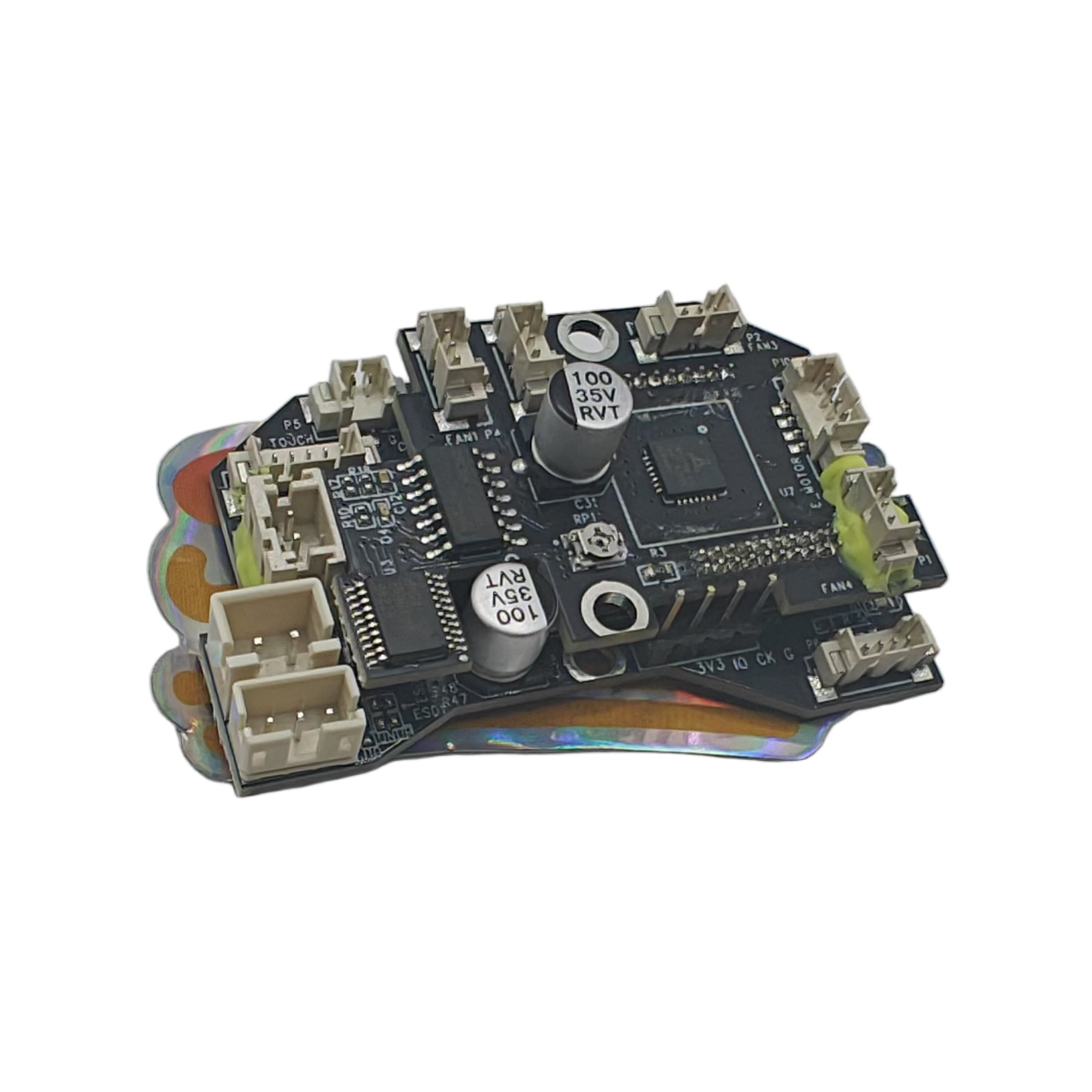 Small electronic circuit board on a light gray surface