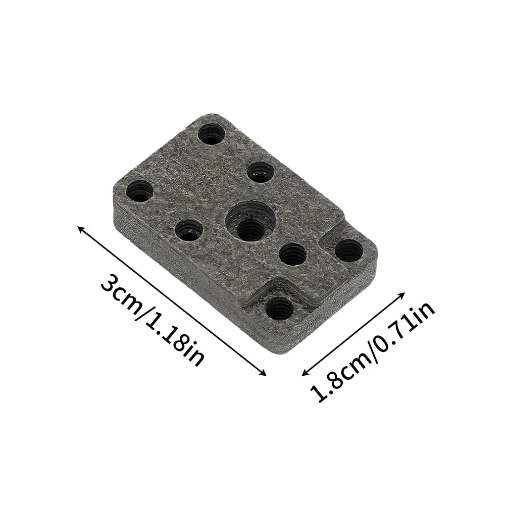 Gray rectangular block with multiple holes and measurements on a white background