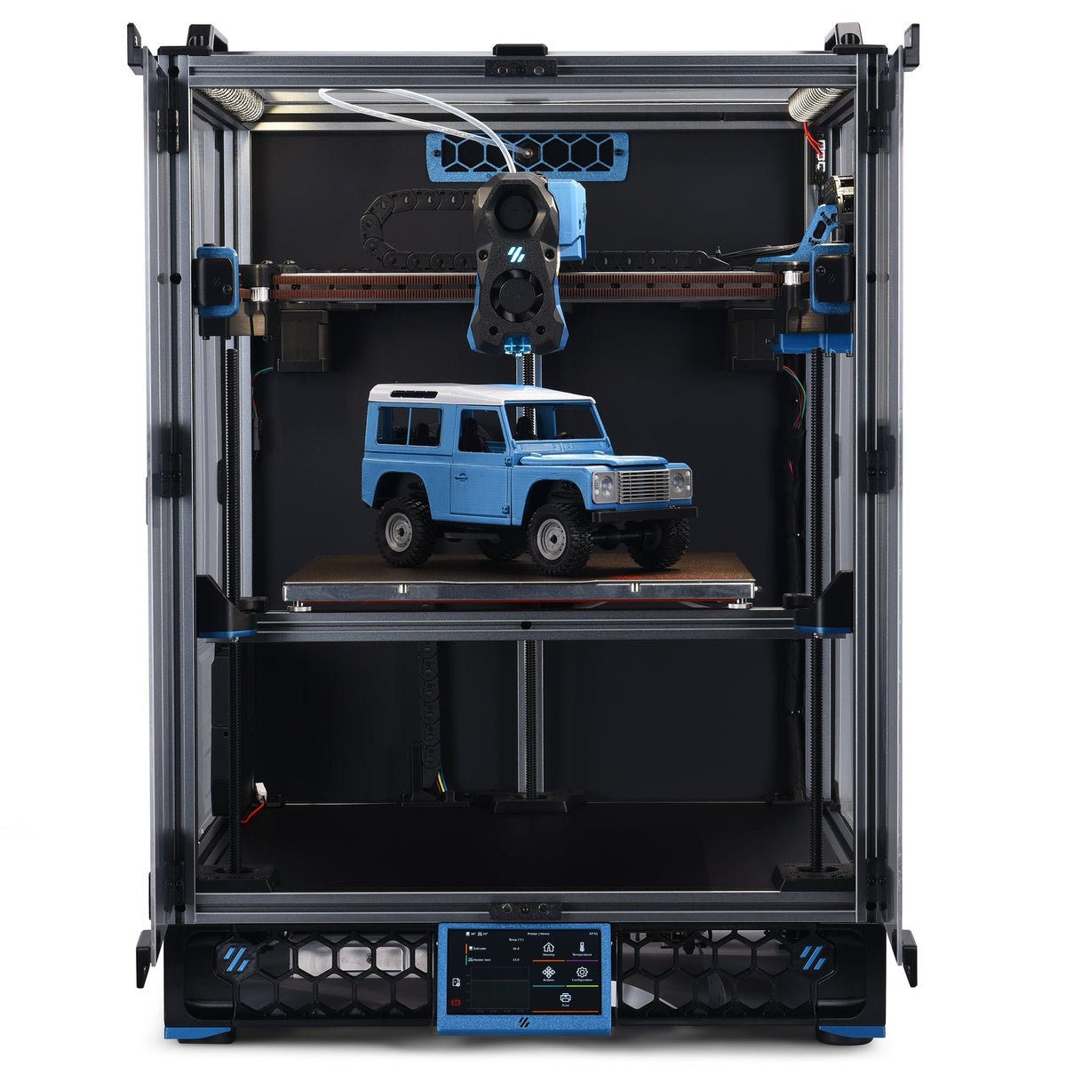 3D printer in operation with a blue model vehicle on its bed