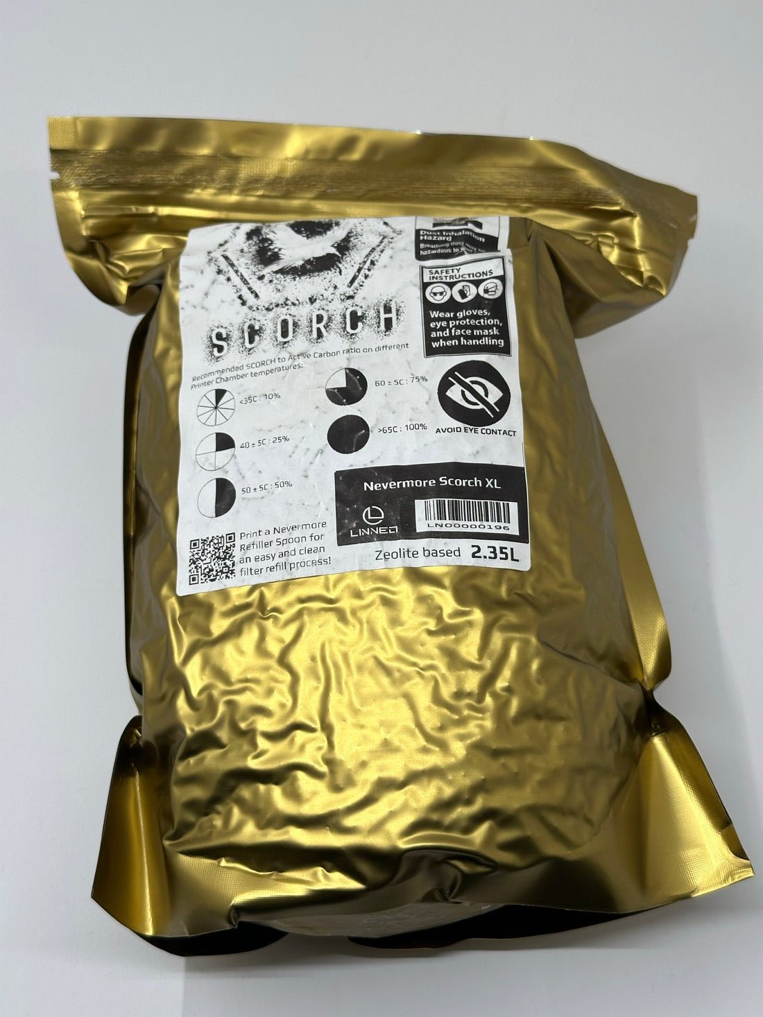 A golden bag of Nevermore Scorch XL 3D Printer Carbon pellets.