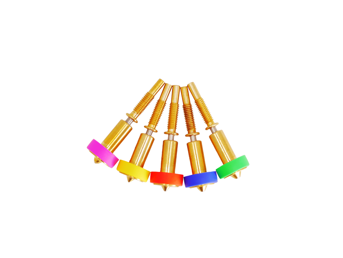 A set of brass 3D printer nozzles with color-coded silicone socks and engraved size numbers.